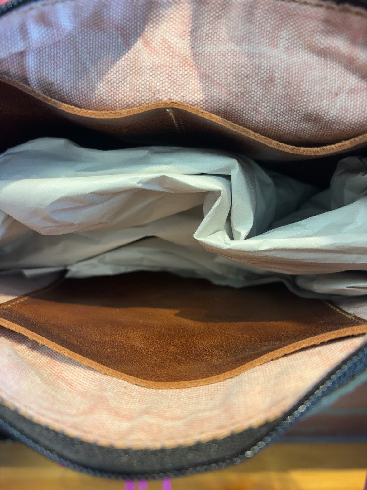 Fabric-lined Austin bag interior with leather pockets