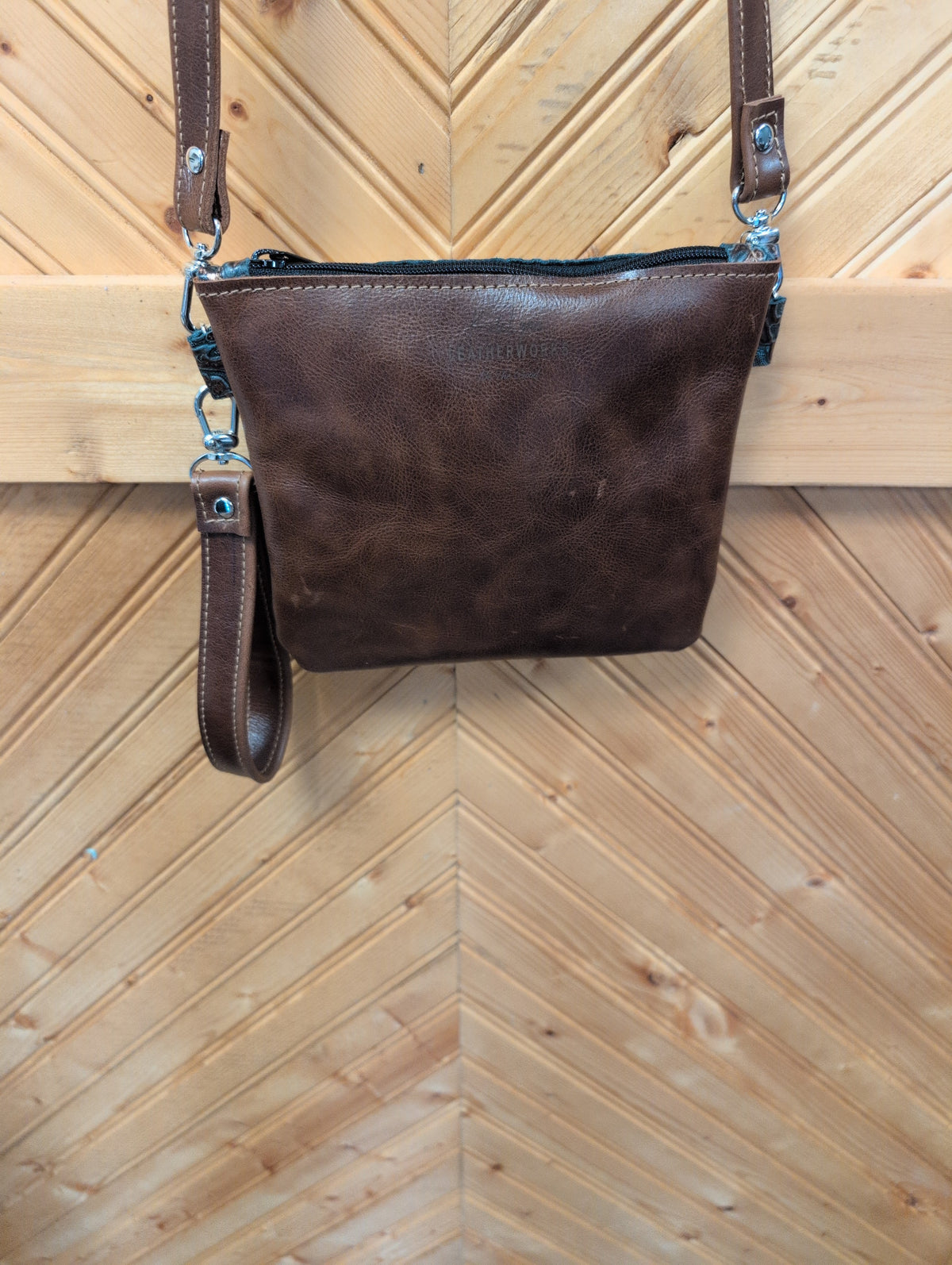 Brown back of Purse Sidekick with matching straps and zipper-top closure