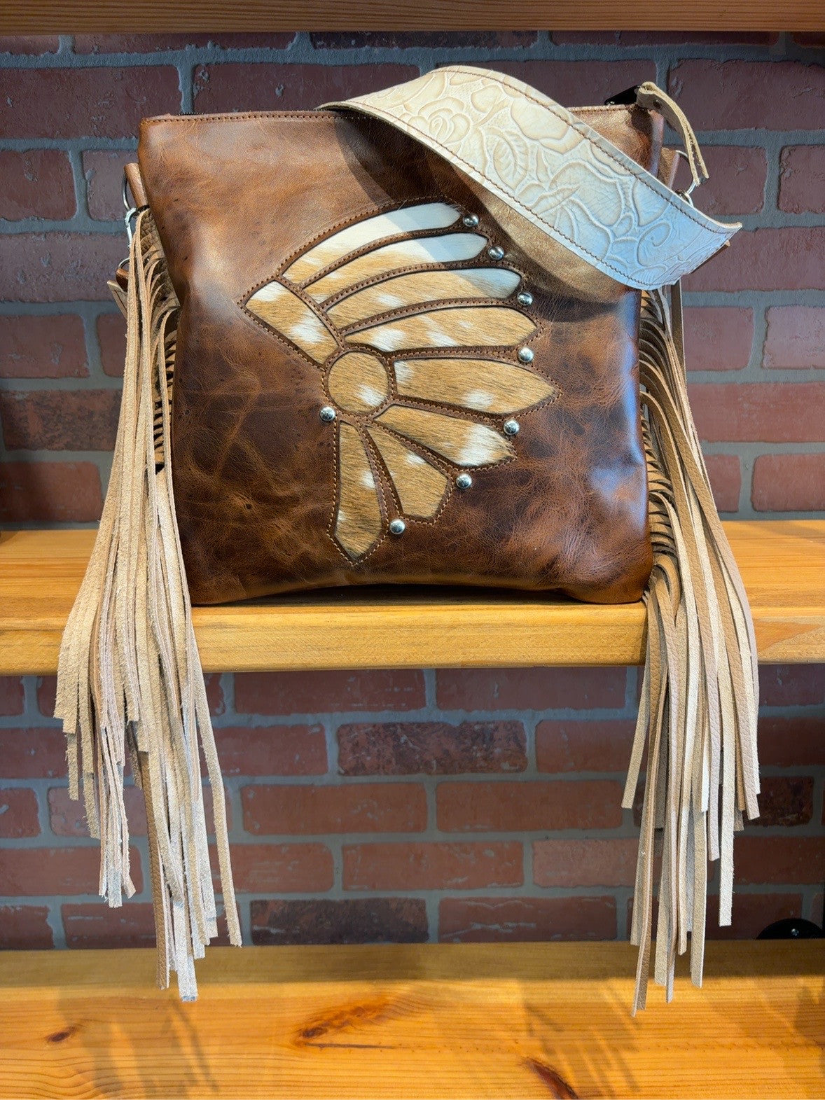 Brown El Paso shoulder bag with axis deer hide inlay, Ivory Roses embossed strap and long tan fringe