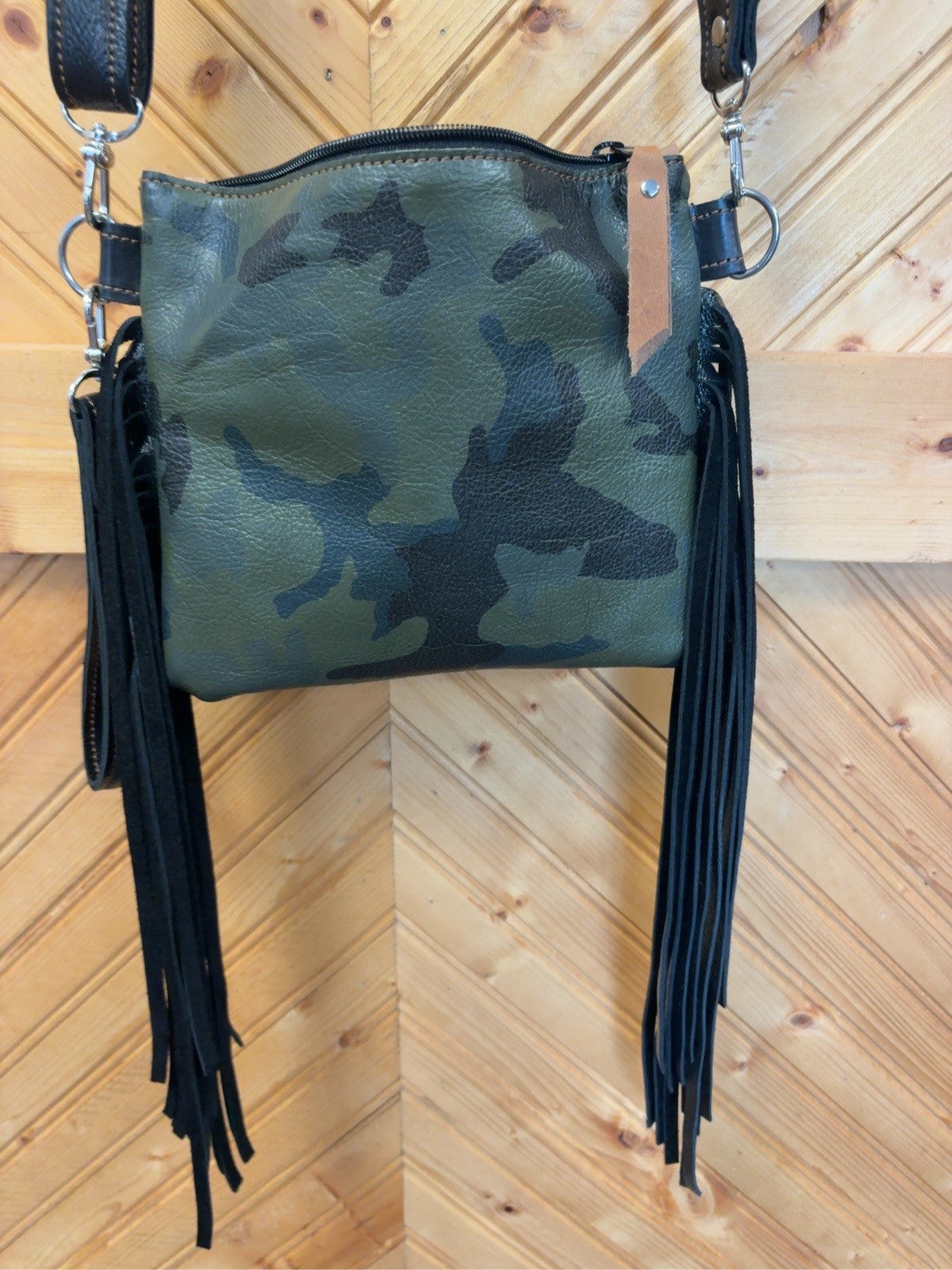 Back of green and black camo leather Purse Sidekick with black fringe and crossbody strap