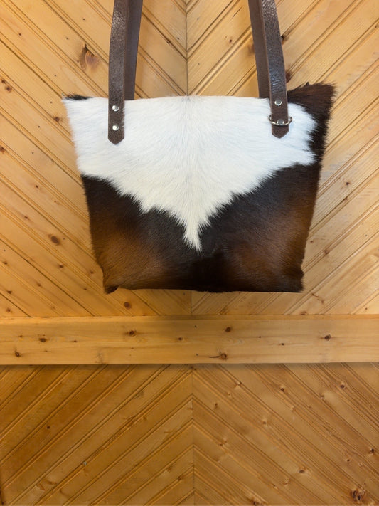 Front of Tucson Mini with brown-and-white cowhide and brown shoulder straps